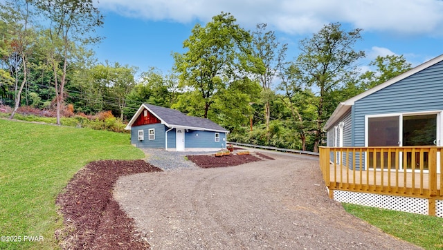 136 Heaters Hill Rd, Matamoras, PA 18336 - garage featuring view of wooded area and driveway