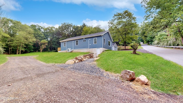 136 Heaters Hill Rd, Matamoras, PA 18336 - view of front facade with driveway and a front yard