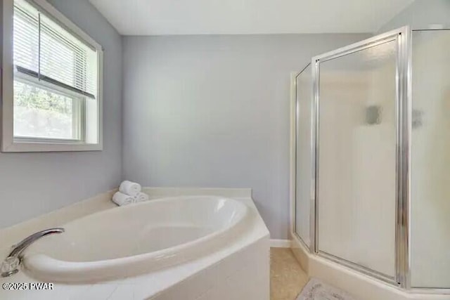full bath featuring a bath and a stall shower