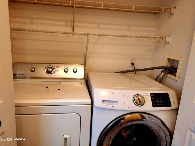 laundry room with separate washer and dryer