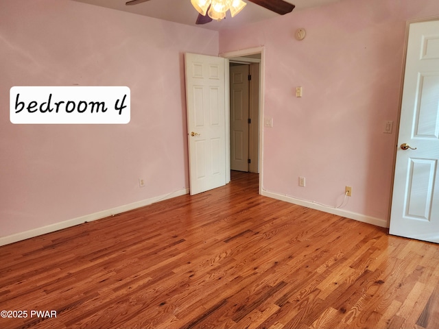 empty room featuring light hardwood / wood-style flooring and ceiling fan