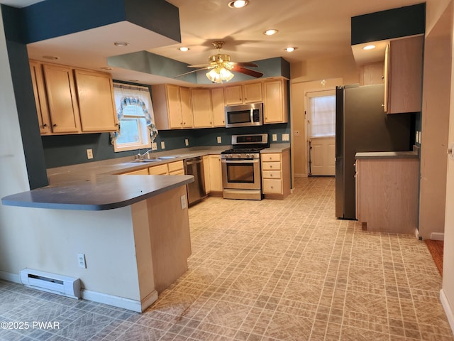 kitchen with ceiling fan, a baseboard radiator, kitchen peninsula, light brown cabinetry, and appliances with stainless steel finishes