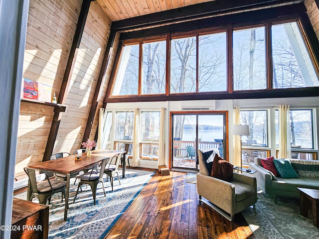 living room with hardwood / wood-style floors, high vaulted ceiling, and wood ceiling