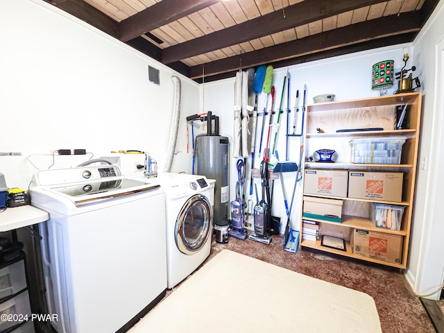 clothes washing area with washing machine and dryer, water heater, wood ceiling, and dark carpet