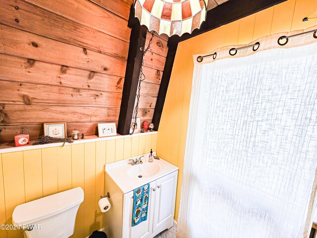176 Fawn Lake Dr, Hawley, PA 18428 - half bath with wood walls, vanity, and toilet