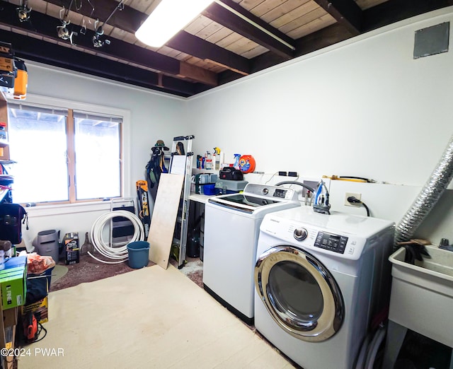 laundry room featuring washing machine and dryer and wood ceiling