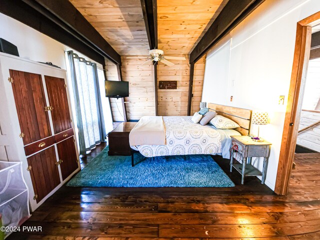 bedroom with ceiling fan, wood walls, wood ceiling, and dark wood-type flooring