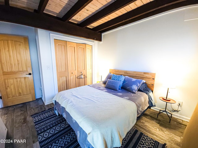 176 Fawn Lake Dr, Hawley, PA 18428 - bedroom featuring wood finished floors, baseboards, a closet, and wood ceiling with exposed beams