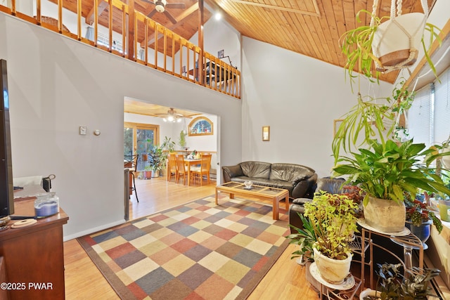 living room featuring wooden ceiling, hardwood / wood-style flooring, and ceiling fan