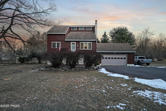 front of property with a garage