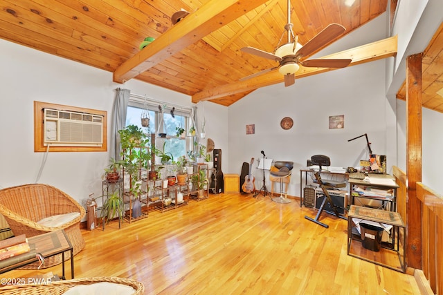 office space featuring an AC wall unit, lofted ceiling with beams, light wood-type flooring, ceiling fan, and wooden ceiling