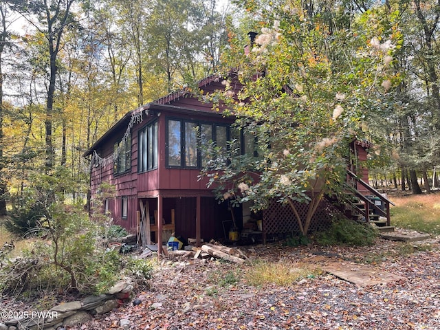 view of home's exterior featuring a sunroom