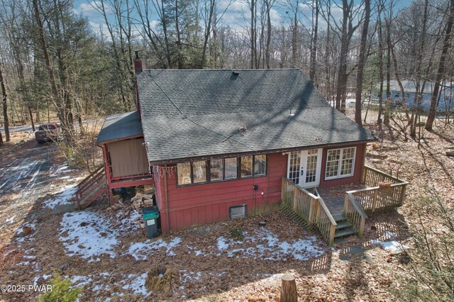 spare room featuring hardwood / wood-style flooring, wooden walls, and a baseboard heating unit