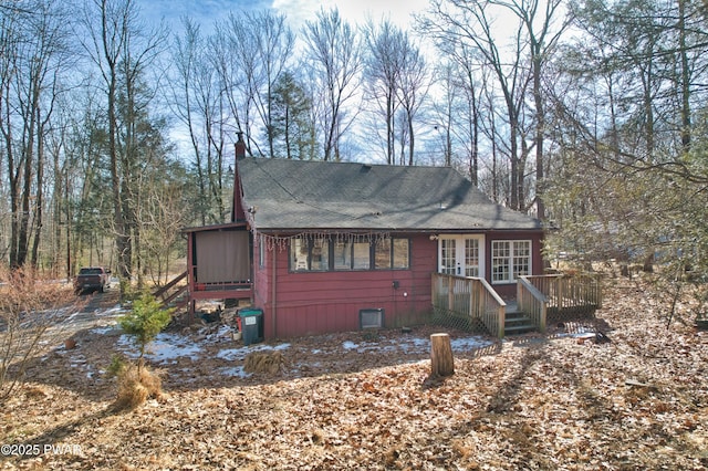 view of front of home featuring french doors and a deck