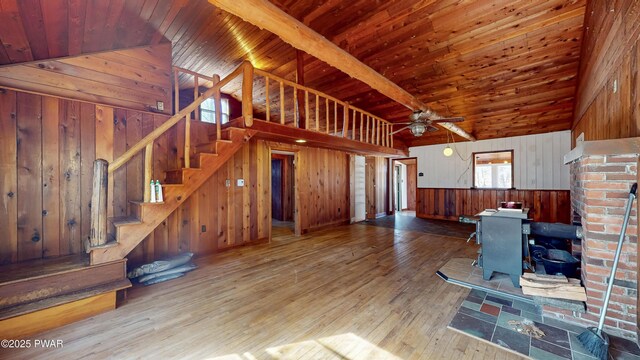 bonus room featuring wood-type flooring, wooden ceiling, wooden walls, and lofted ceiling