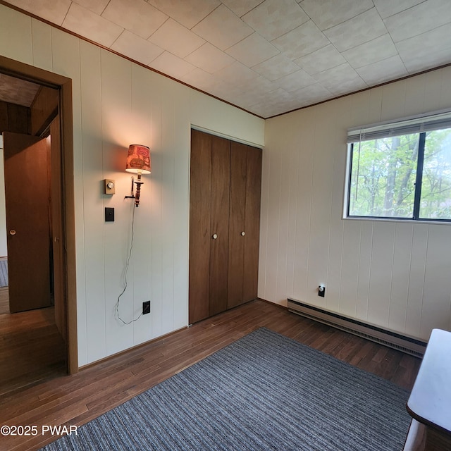 802 Placer Ct, Lords Valley, PA 18428 - unfurnished bedroom with hardwood / wood-style flooring, baseboard heating, and a closet