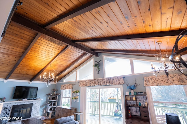 living room featuring wood finished floors, wood ceiling, a brick fireplace, beamed ceiling, and an inviting chandelier