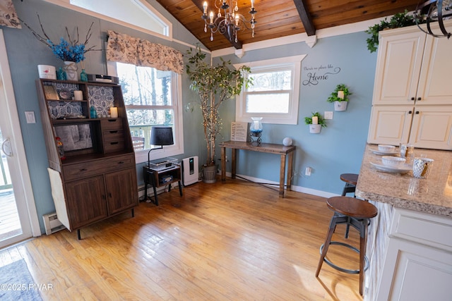 home office featuring vaulted ceiling with beams, a baseboard radiator, an inviting chandelier, light wood-type flooring, and wooden ceiling