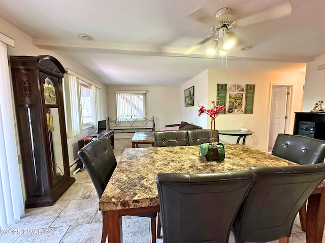 dining area featuring ceiling fan and baseboard heating