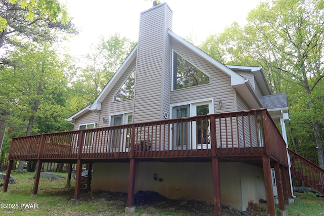 143 Heritage Dr, Lackawaxen, PA 18435 - rear view of house featuring a deck, a chimney, and stairway