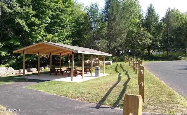 view of property's community with a gazebo and a yard