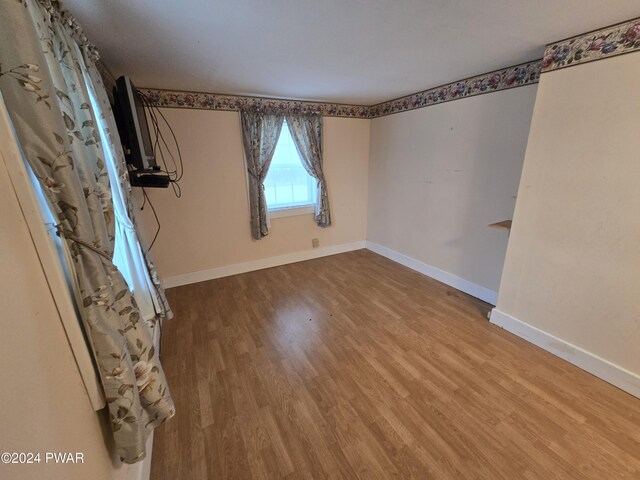 spare room featuring hardwood / wood-style floors