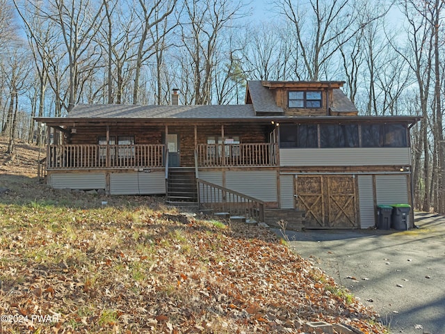 view of front facade with a sunroom