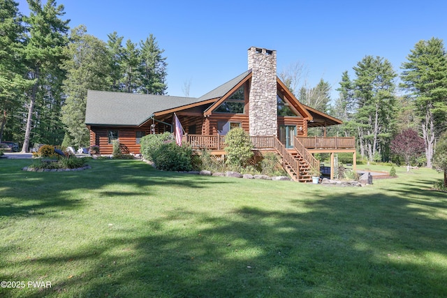 back of property with a chimney, a lawn, a deck, log siding, and stairs