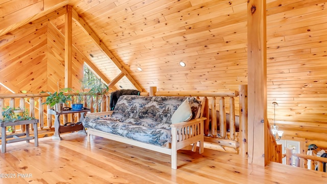 bedroom with wood ceiling, vaulted ceiling, and hardwood / wood-style flooring