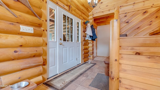 entryway featuring tile patterned floors and rustic walls