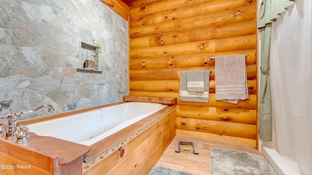 full bath with log walls, curtained shower, a whirlpool tub, and wood finished floors