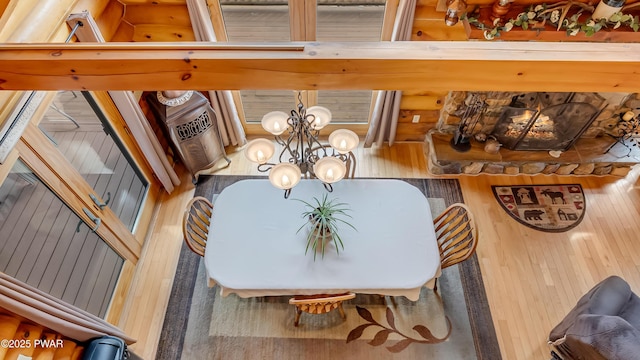 dining space with wood-type flooring and a notable chandelier