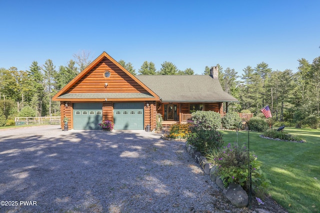 log cabin featuring log siding, an attached garage, a porch, a front yard, and driveway