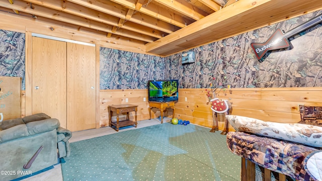 bedroom with carpet floors and wallpapered walls