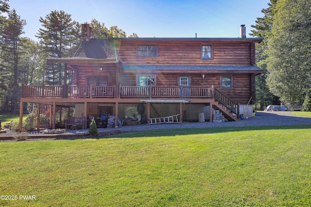rear view of house featuring log siding, a chimney, stairs, and a deck