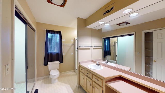 bathroom with toilet and vanity