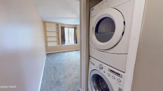 washroom with stacked washer / drying machine, carpet flooring, and a textured ceiling