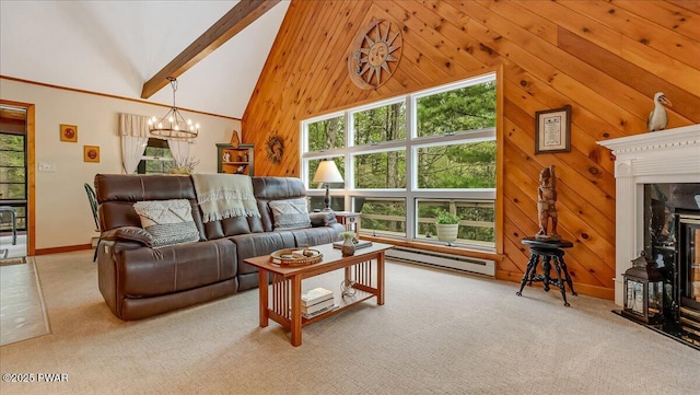 32 White Oak Dr, Lakeville, PA 18438 - living room with a chandelier, a baseboard radiator, high vaulted ceiling, carpet floors, and wooden walls
