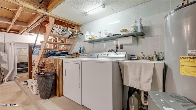 32 White Oak Dr, Lakeville, PA 18438 - laundry room with electric water heater, washing machine and dryer, and a sink