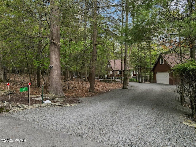 32 White Oak Dr, Lakeville, PA 18438 - view of front facade with a detached garage and gravel driveway