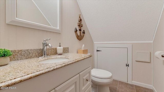 32 White Oak Dr, Lakeville, PA 18438 - bathroom with vanity, toilet, a textured ceiling, and vaulted ceiling