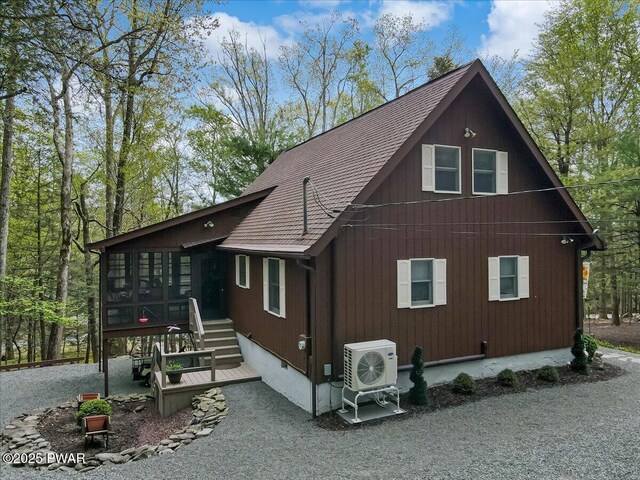 32 White Oak Dr, Lakeville, PA 18438 - view of property exterior with a sunroom, ac unit, and roof with shingles