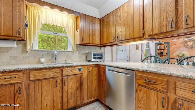 32 White Oak Dr, Lakeville, PA 18438 - kitchen with dishwasher, a sink, brown cabinetry, and backsplash