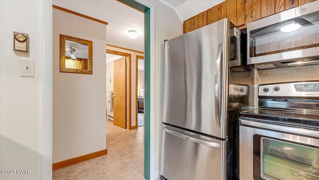 32 White Oak Dr, Lakeville, PA 18438 - kitchen featuring appliances with stainless steel finishes, brown cabinets, ornamental molding, baseboards, and light tile patterned floors