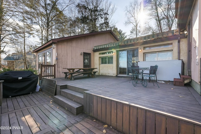 wooden terrace with area for grilling