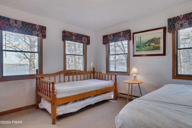 bedroom featuring carpet and a baseboard radiator