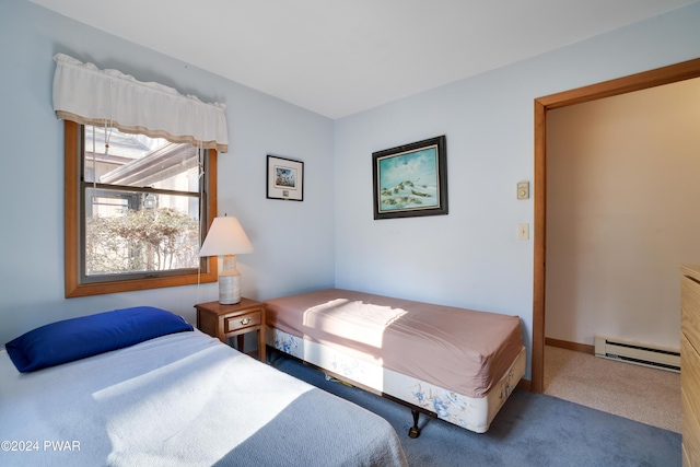 carpeted bedroom with a baseboard radiator