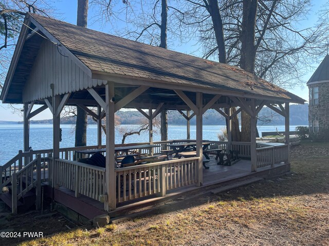 view of dock featuring a gazebo and a water view