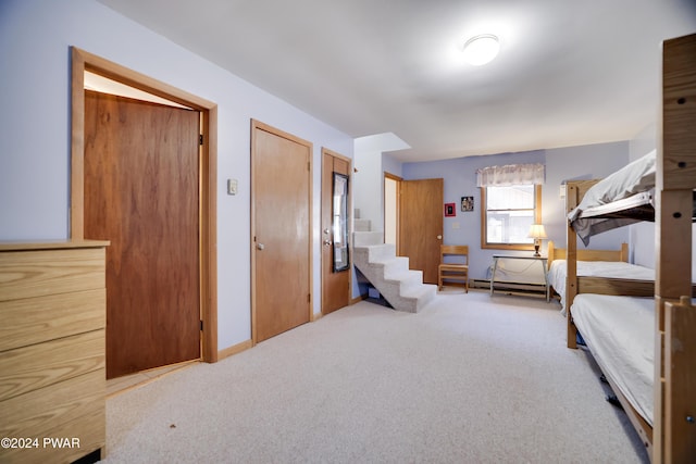 bedroom with light carpet and two closets