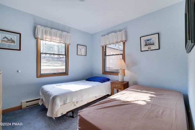 carpeted bedroom with baseboard heating